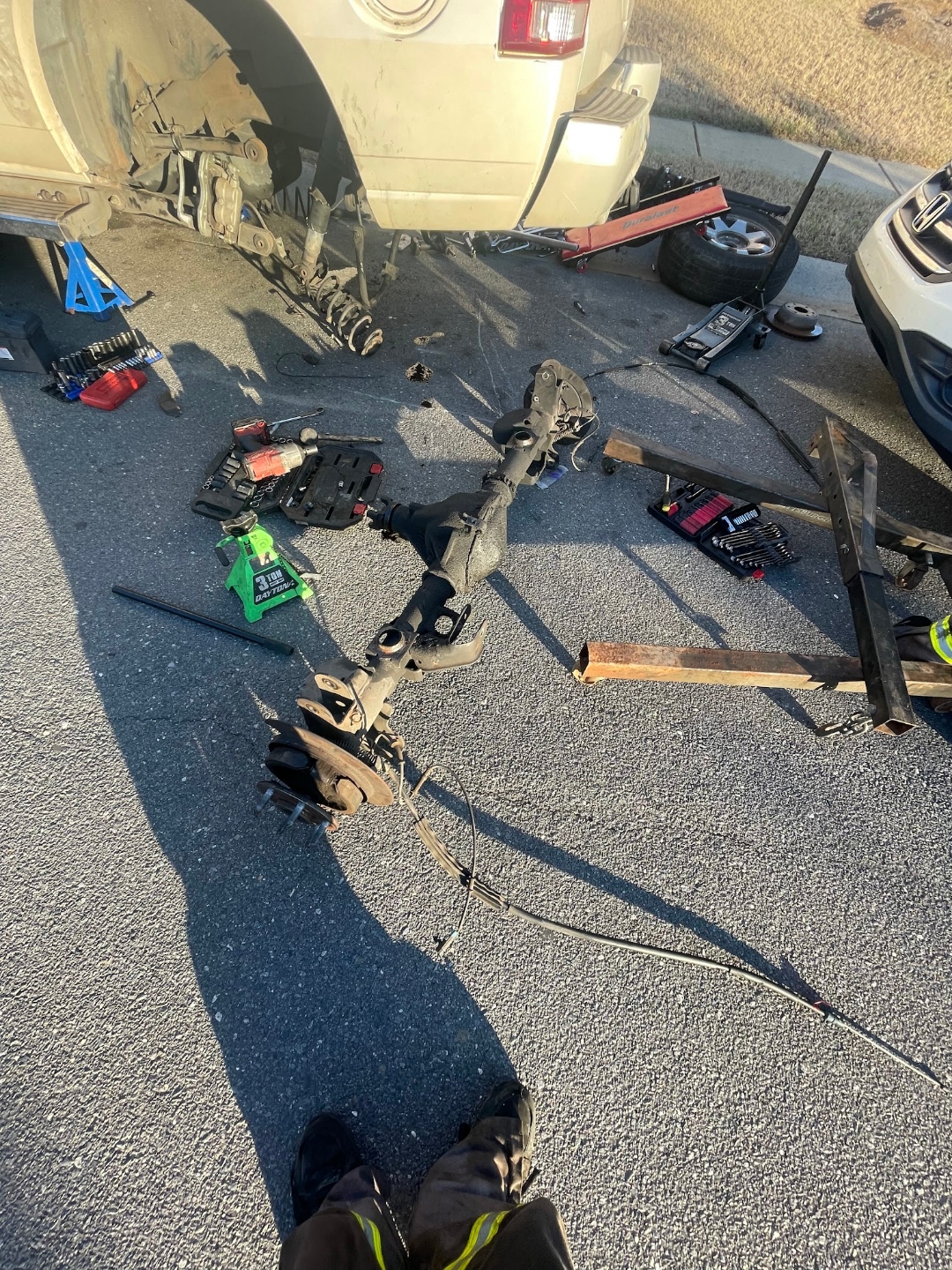 Mobile mechanic suspension repair near Concord NC with tools and vehicle lifted safely
